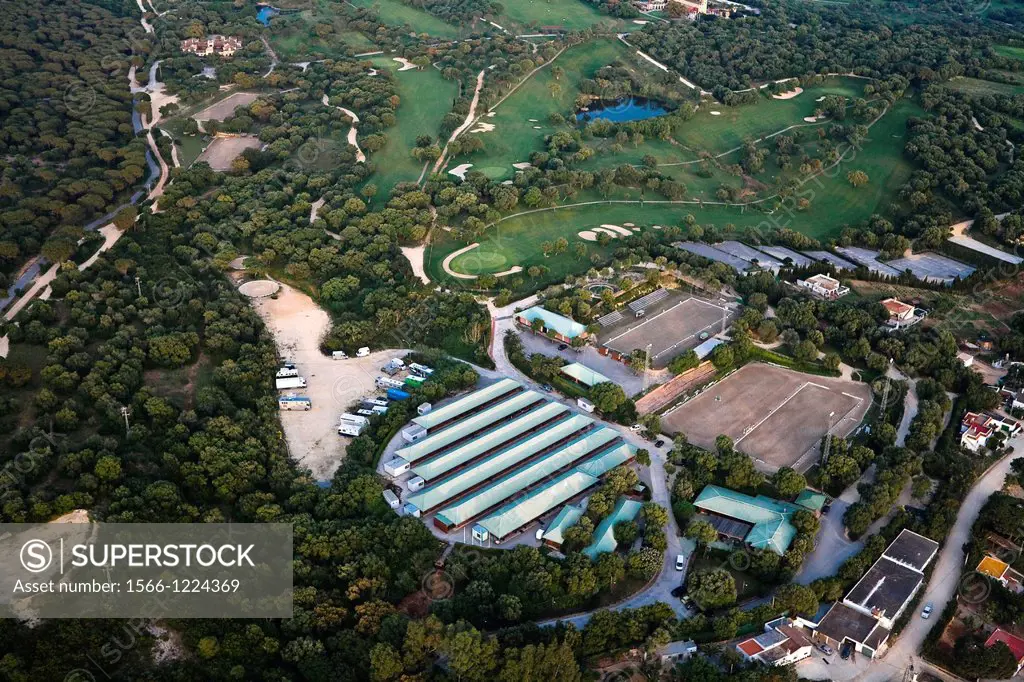 Horse riding club and facilities  A golf course in the back  Aerial view.