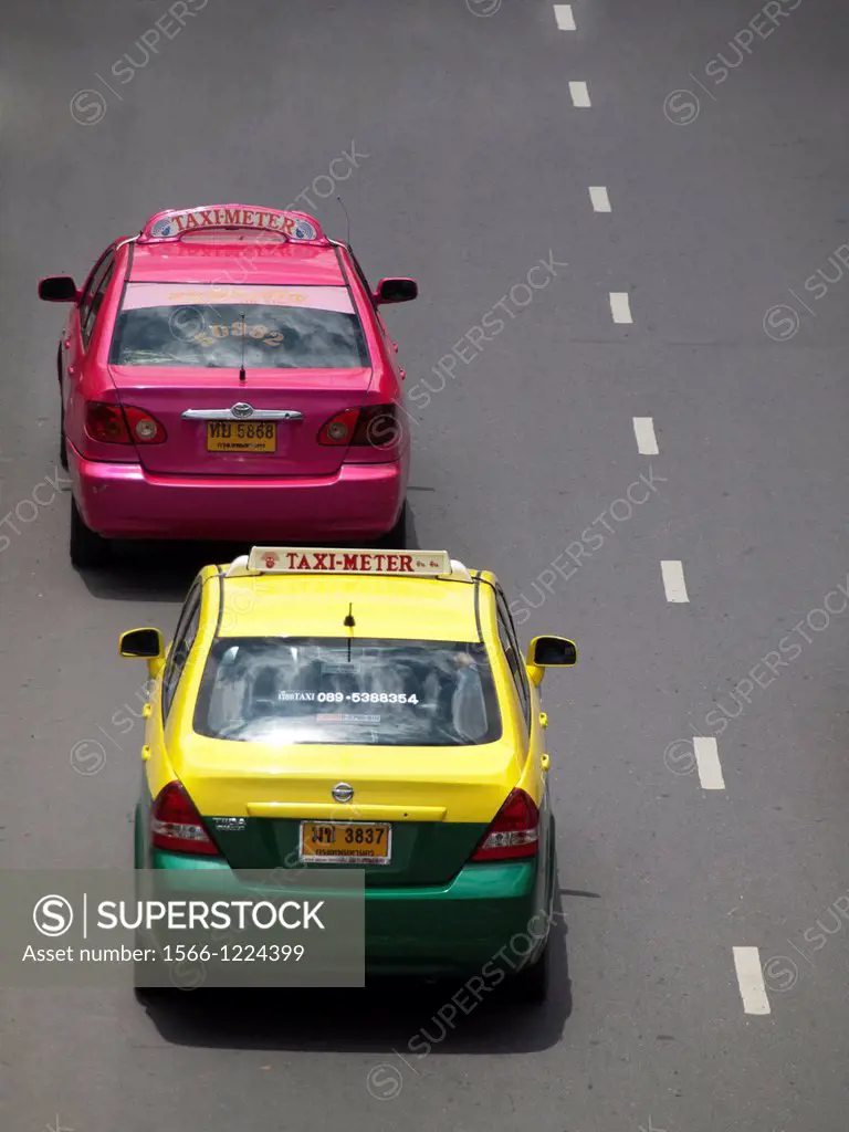 Colorful taxis driving in the city of Bangkok in Thailand