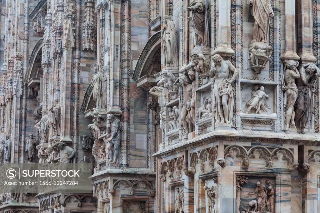 Abstract image of complex details on the front exterior wall of the Duomo, Milano.
