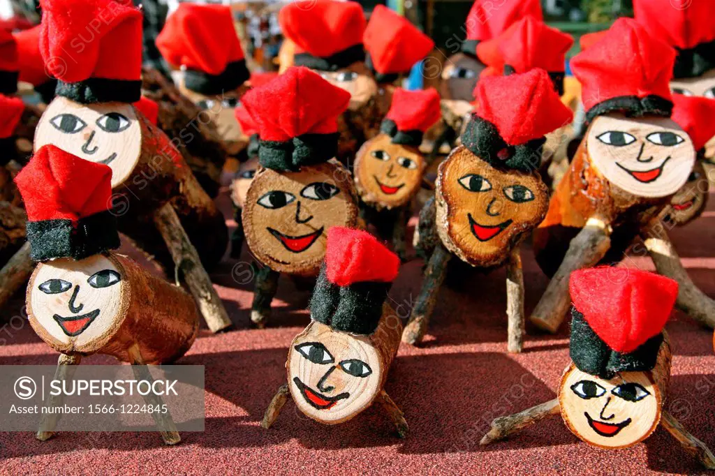 Tions de Nadal (Christmas logs) for sale at Christmas market. Typical Catalan tradition.