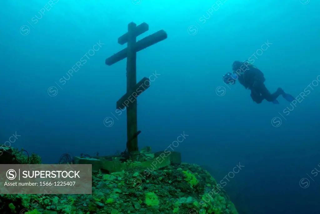 The diver looks at a cross ´This cross is consecrated and established on Feast of the Ascension 09 06 2005´  Lake Baikal, Siberia, the Russian Federat...