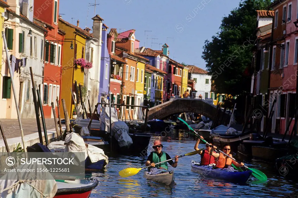 kayak trip on a canal of Burano island, Venice, Veneto region, Italy, Europe