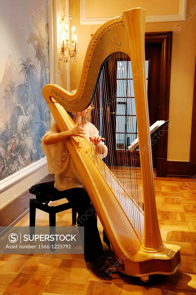 Switzerland, The Graubunden canton, Saint-Moritz, Historic and luxury hotel Badrutt Palace, harp musician Marta Kaszap during breakfast