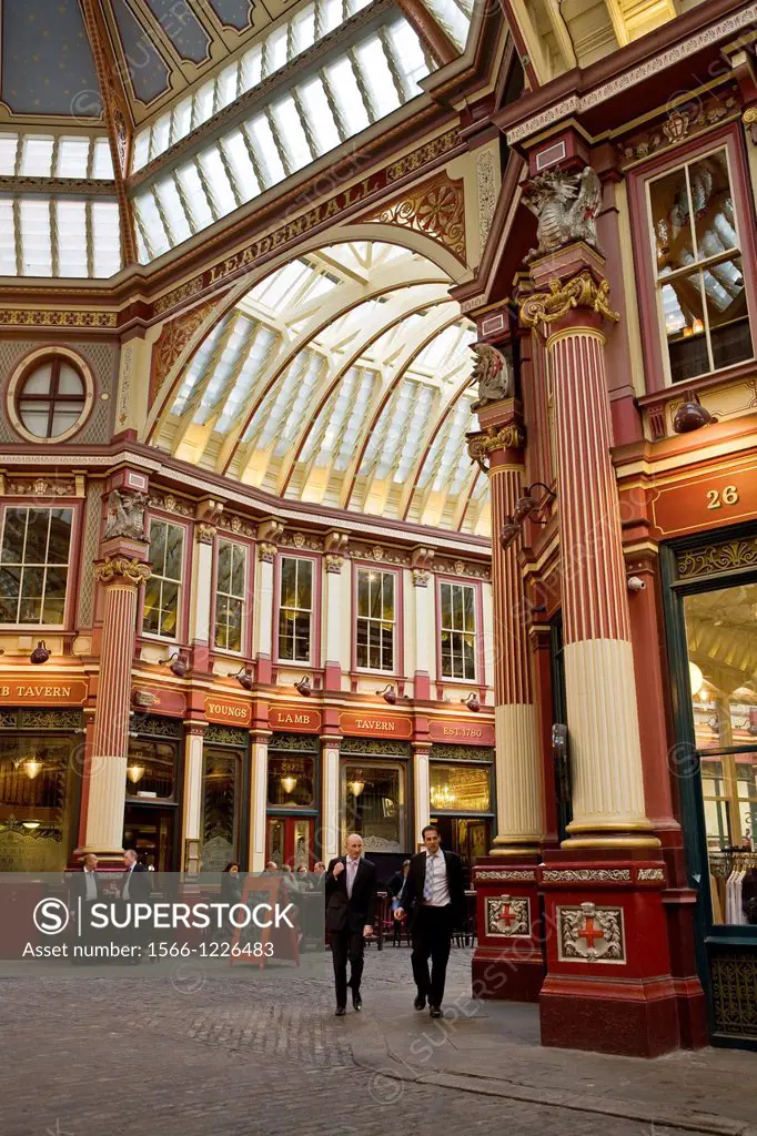 Business people drinking after work at pub in Leadenhall Market designed 1881 by Sir Horace Jones, The City, London, England