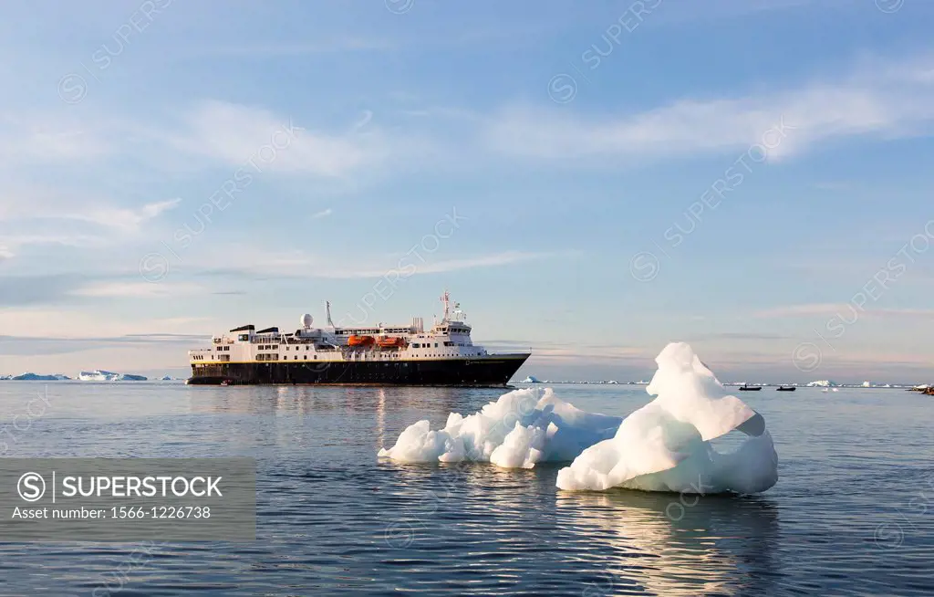 The Lindblad Expeditions ship National Geographic Explorer amongst grounded icebergs in Vikingbukta Viking Bay, Scoresbysund, Northeast Greenland