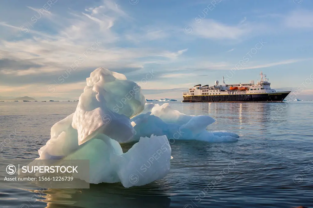 The Lindblad Expeditions ship National Geographic Explorer amongst grounded icebergs in Vikingbukta Viking Bay, Scoresbysund, Northeast Greenland