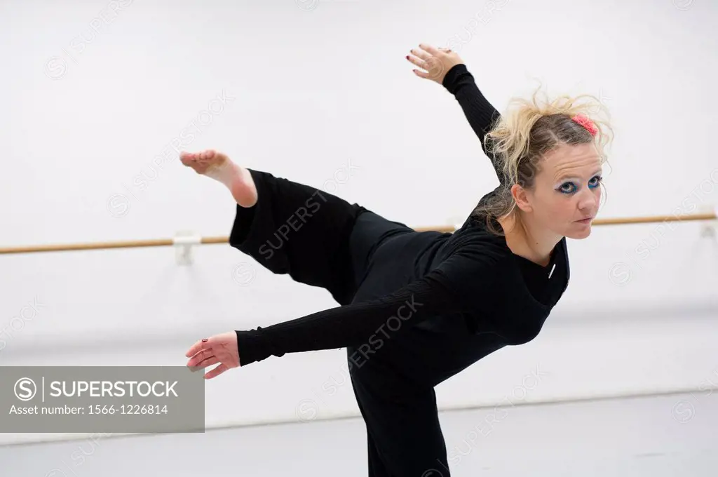 Tilburg, Netherlands. A professional dancer and choreographer of modern dance during a rehearsal of improvised, modern dance.