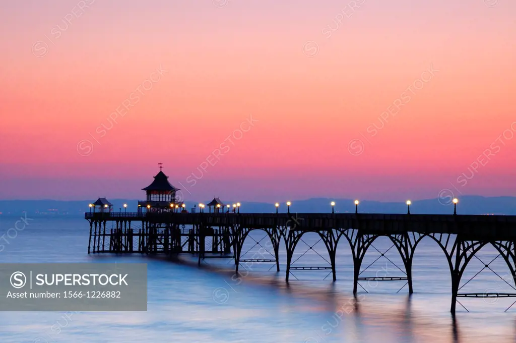 The Victorian pier in the Bristol Channel at the seaside town of Clevedon at dusk  North Somerset, England, United Kingdom
