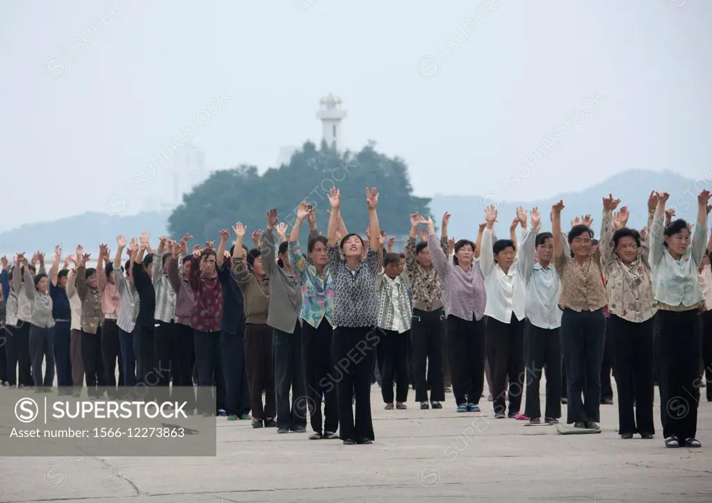 Women Raising Hands During Exercise Session, Wonsan, North Korea