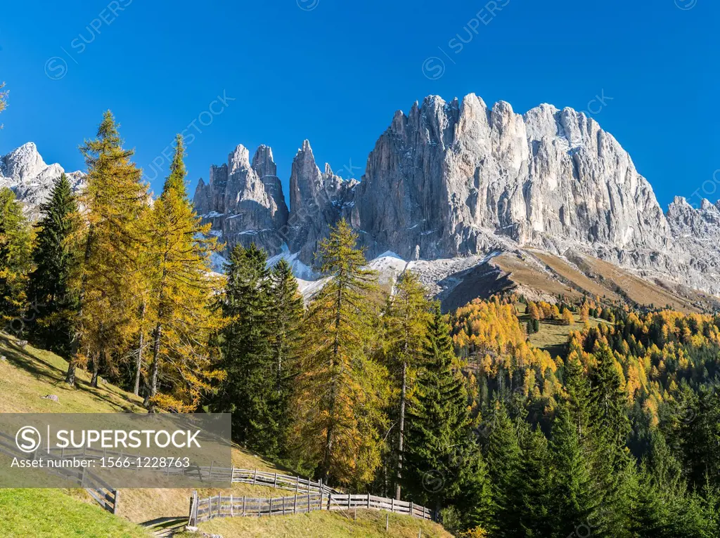 Rosengarten also called Catinaccio mountain range in the Dolomites of South Tyrol Alto Adige during autumn  The Vajolet Towers and the rock face of mo...