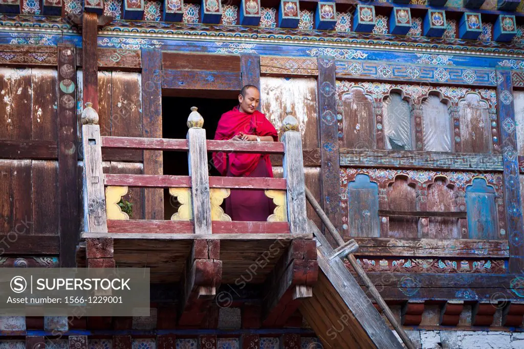 Monk in Wangdichholing Palace built in 1857 as the Kingdoms first palace, Bumthang, Bhutan, Asia.