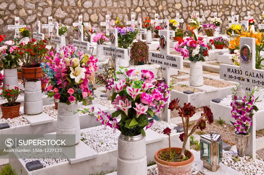Crosses and flower arrangements at the Santa Maria della Neve church and memorial cemetery near Santa Agata, Italy