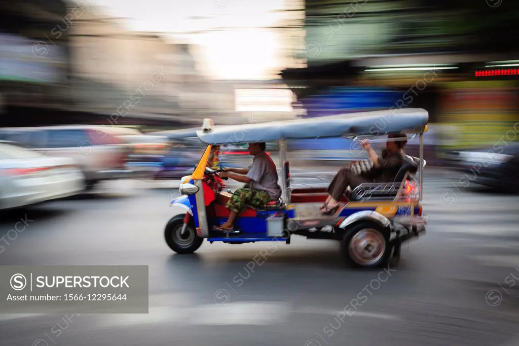 Tuk-tuk driving fast in Chinatown. Bangkok. Thailand.