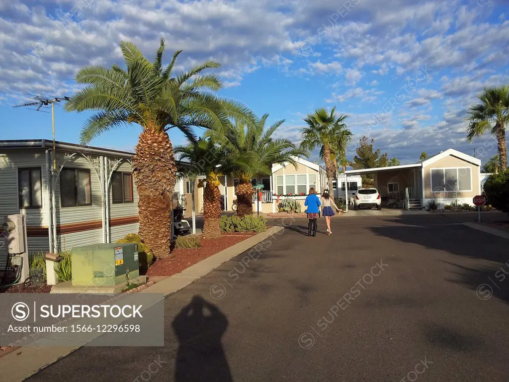 Mother and daughter walking while on vacation at a seniors active living trailer park, Mesa, Arizona, United States of America.