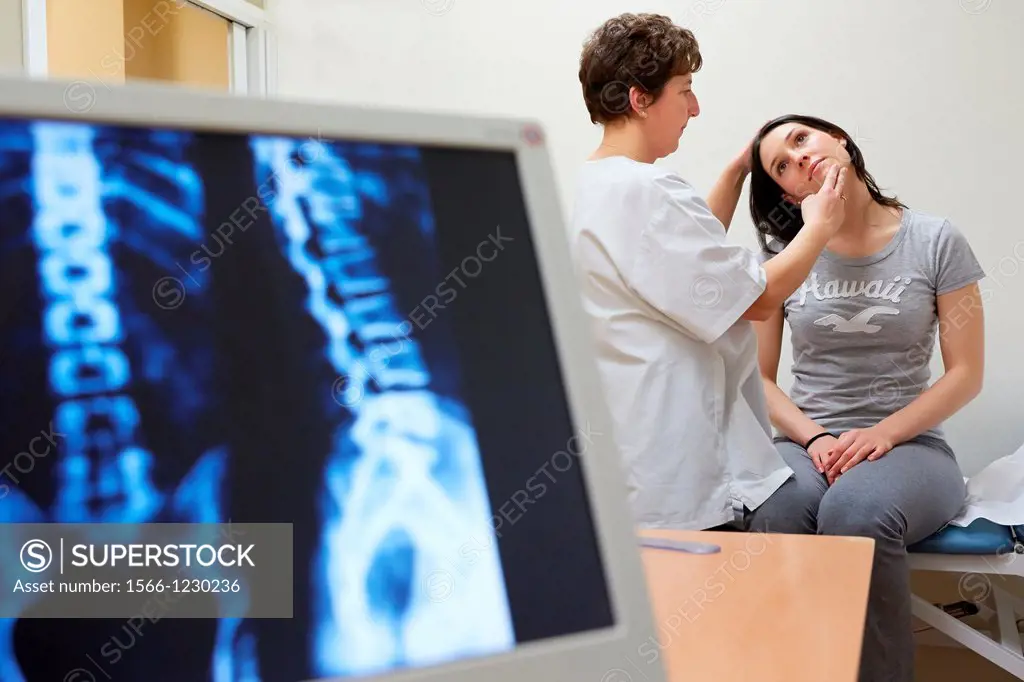 Doctor checking neck tilt, Column X-ray image, Physiotherapy medical center, Donostia, San Sebastian, Gipuzkoa, Basque Country, Spain
