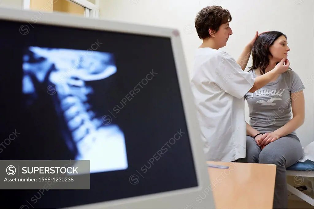 Doctor neck rotation checking, Cervical X-ray image, Physiotherapy medical center, Donostia, San Sebastian, Gipuzkoa, Basque Country, Spain