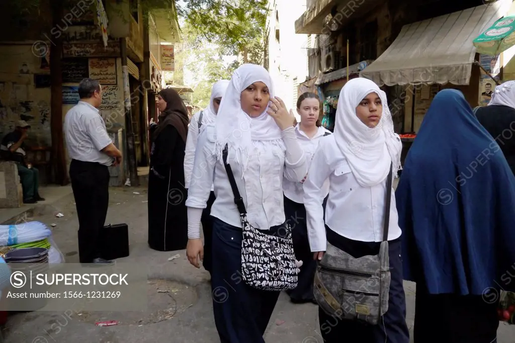 Egypt. Street scenes in so called ´Islamic Cairo´, the old quarter of the city near Bab Zuela. High school girls wearing headscarfs