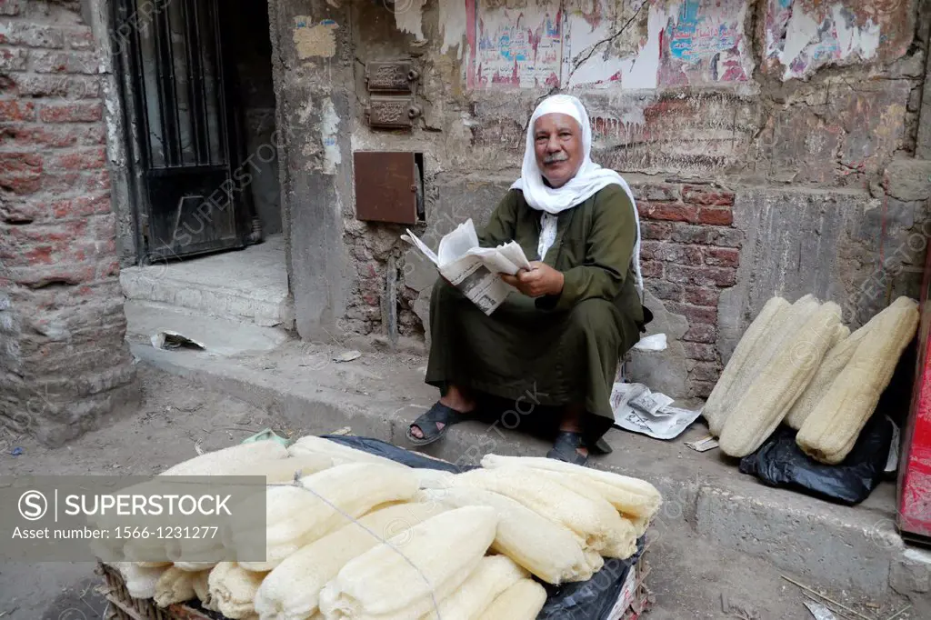 Egypt. Street scenes in so called ´Islamic Cairo´, the old quarter of the city near Bab Zuela. Man selling loofas