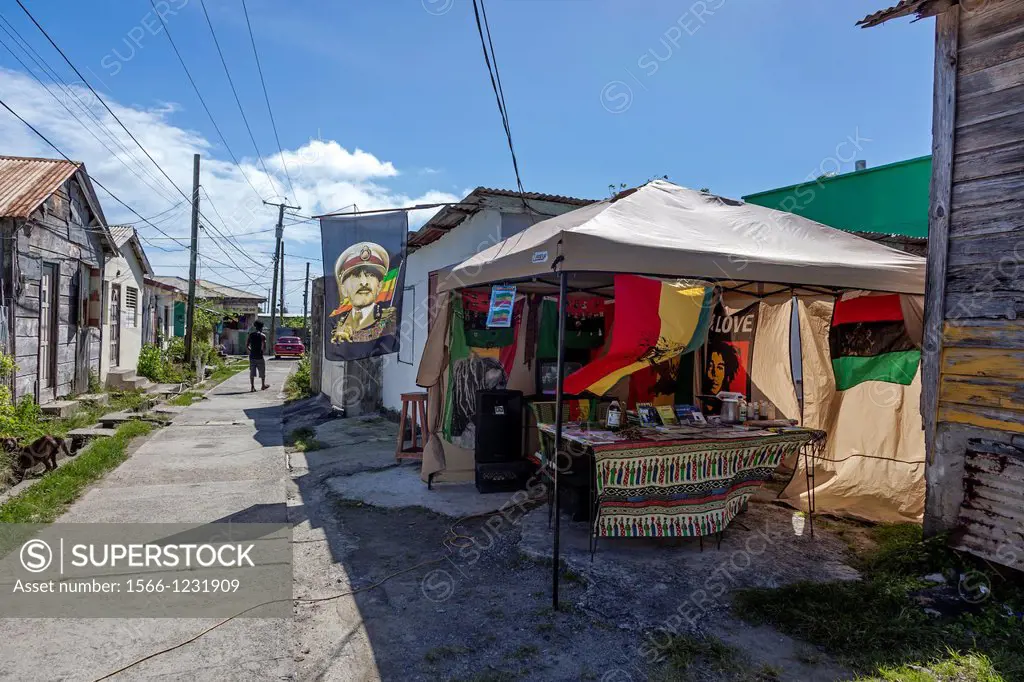 Side street in Vieux Fort, St Lucia with a stall selling Rastafarian material, Reggae music and posters and a flag of the Ethiopian Emperor Haile Sela...