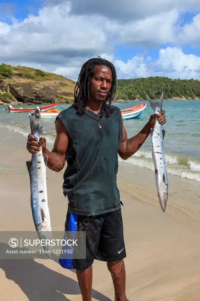 Local fisherman with fish from a fresh catch at Savannes Bay, St Lucia