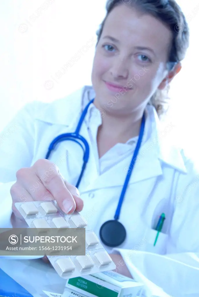 Smoking cessation  Doctor holding out a packet of nicotine chewing gum