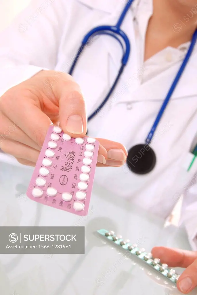 Family planning  Doctor passing over a packet of oral contraceptive pills