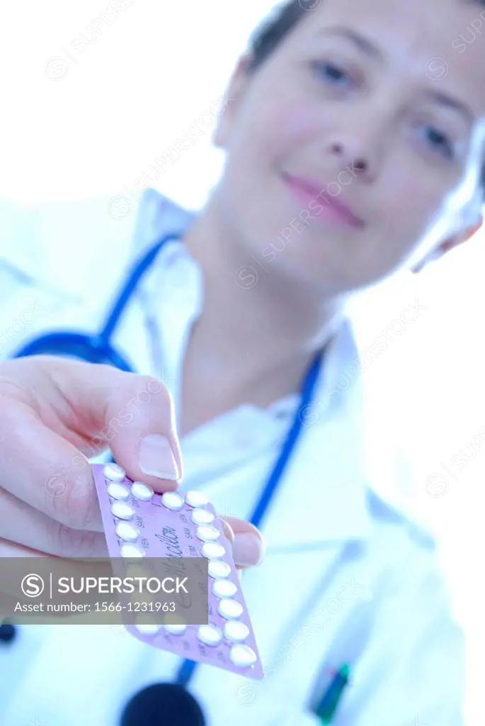 Family planning  Doctor passing over a packet of oral contraceptive pills