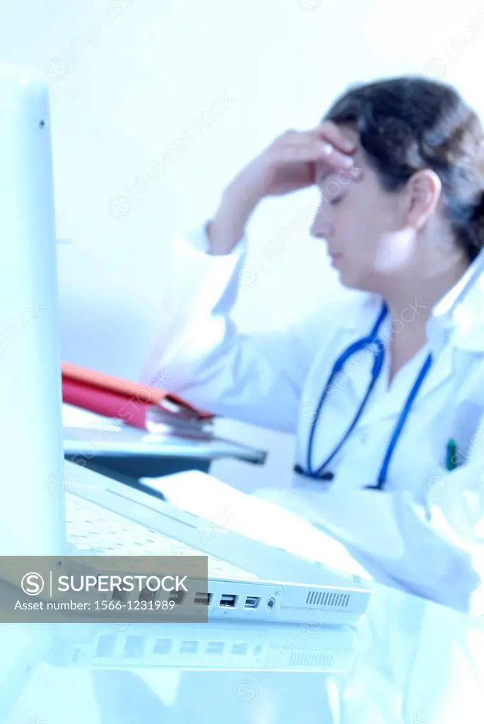 Stressed doctor  Tired general practice GP doctor looking stressed and worried
