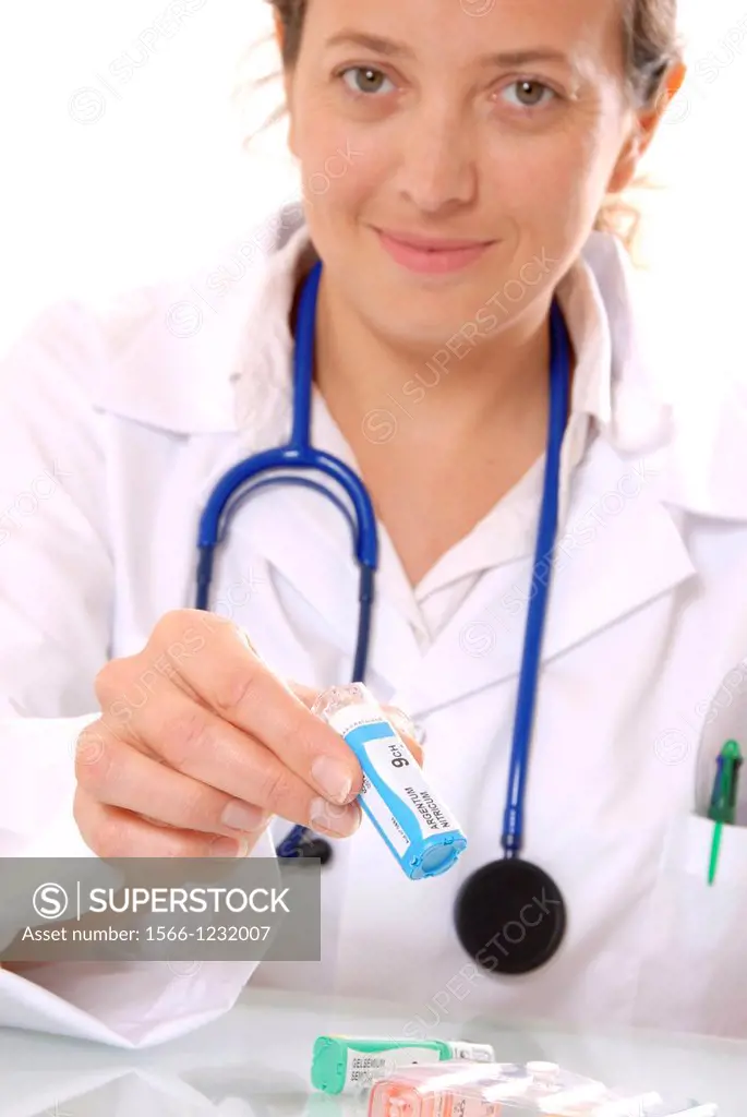 Homeopathic medicine  GP holding a dispenser containing a homeopathic remedy