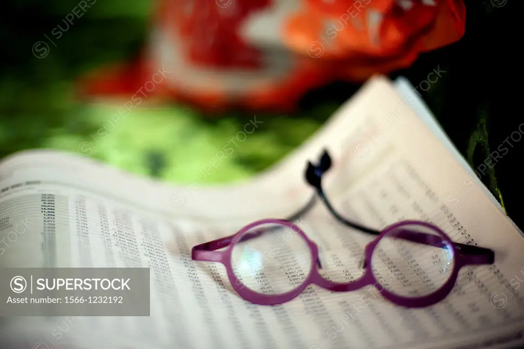 Glasses on Financial Newspaper,