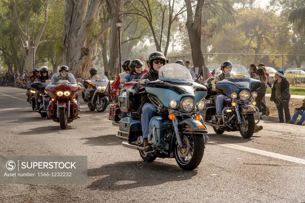 Local motorcyclists participate in a parade in Riverside, CA