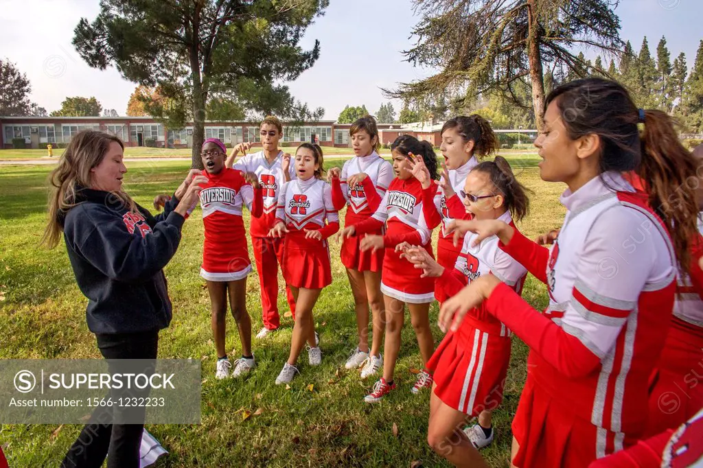The coach of a multiethnic team of deaf cheerleaders trains them using sign language at the California School for the Deaf in Riverside, CA.A deaf His...