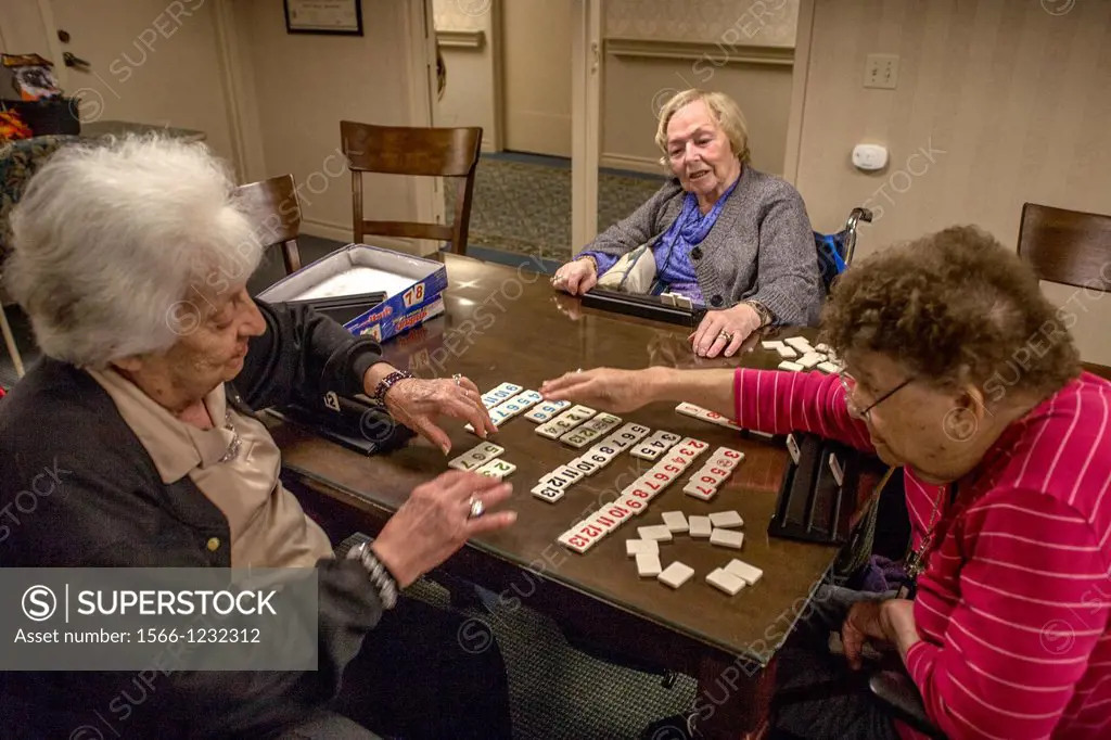 Elderly residents at a retirement home in Mission Viejo, CA, play a board numbers game
