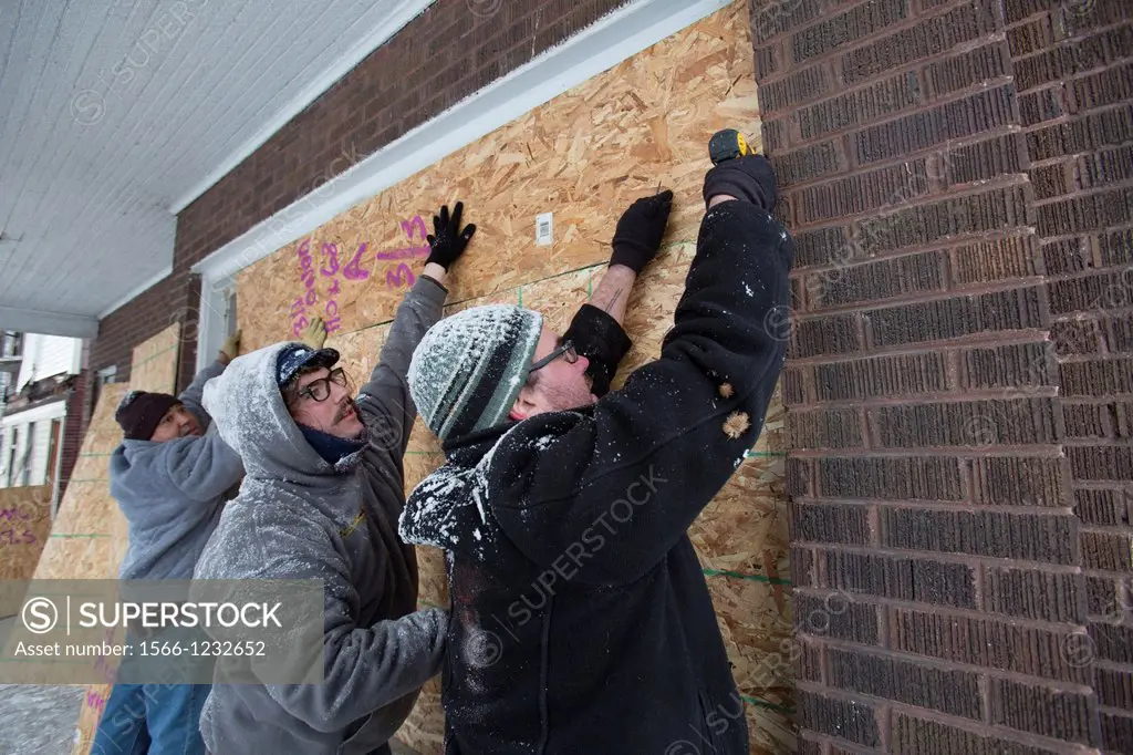 Detroit, Michigan - On Martin Luther King Jr  Day, volunteers from Wayne State University and neighborhood residents boarded up abandoned houses near ...