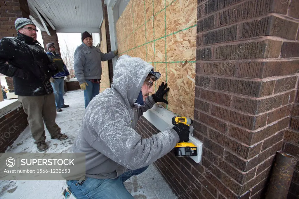 Detroit, Michigan - On Martin Luther King Jr  Day, volunteers from Wayne State University and neighborhood residents boarded up abandoned houses near ...