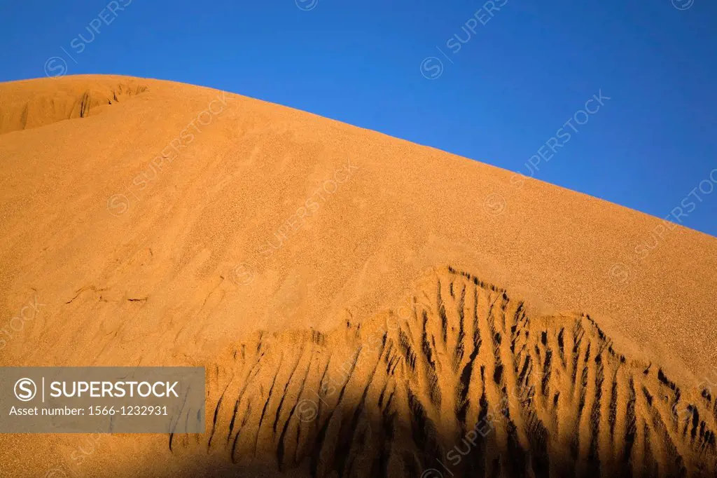 Mound of sand around sunset in a commercial sandpit, Quebec, Canada