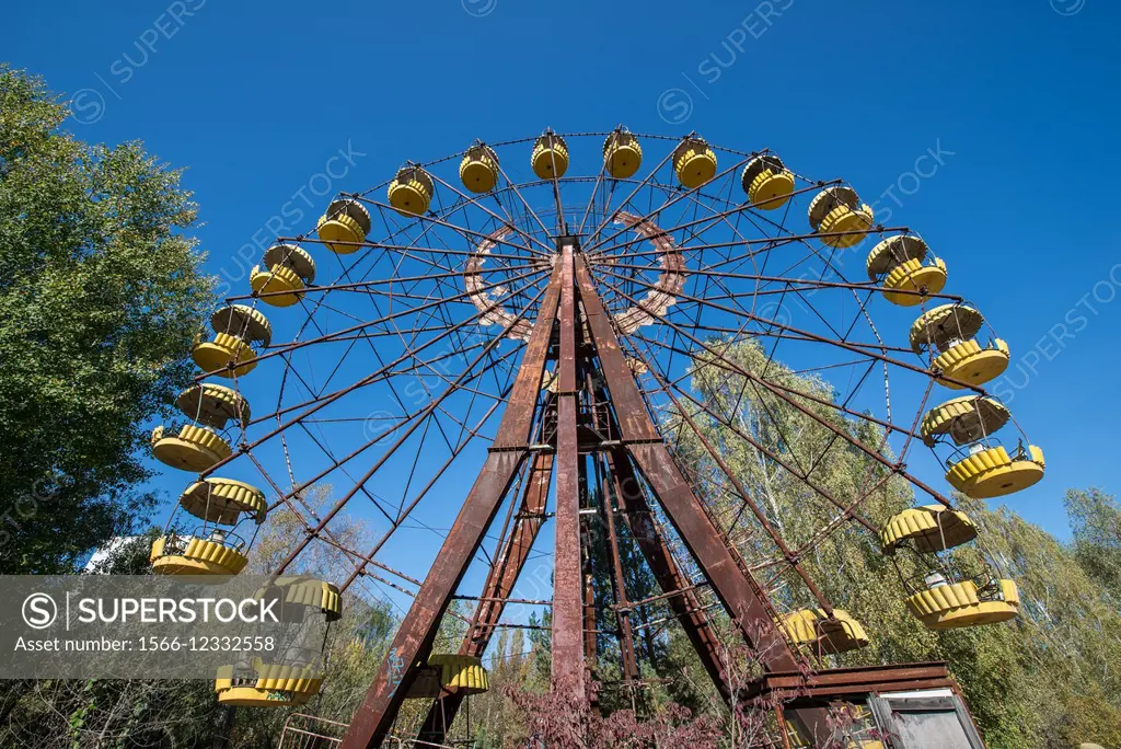 Ferris wheel in funfair in city park of Pripyat abandoned city, Chernobyl Exclusion Zone, Ukraine.