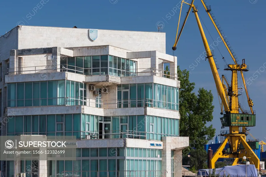 Romania, Danube River Delta, Tulcea, waterfront buildings by Danube River.