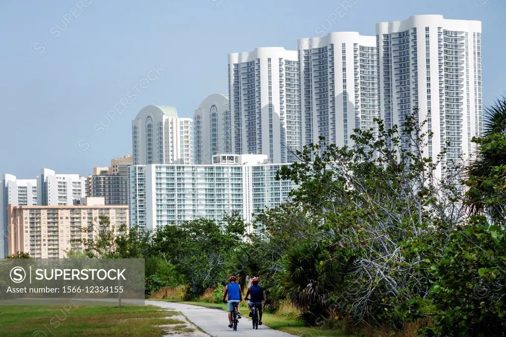 Florida, Miami, North Miami, Oleta River State Park, bike trail, high rise condominium buildings.