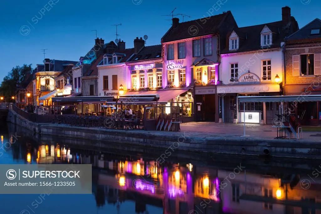 France, Picardy Region, Somme Department, Amiens, Quartier St-Leu, restaurants along the Somme River, dusk