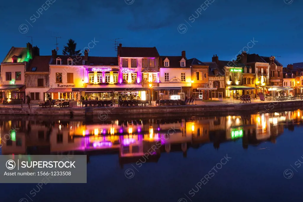 France, Picardy Region, Somme Department, Amiens, Quartier St-Leu, restaurants along the Somme River, dusk