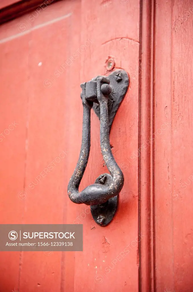 Door knocker on a red door in Charleston South Carolina.
