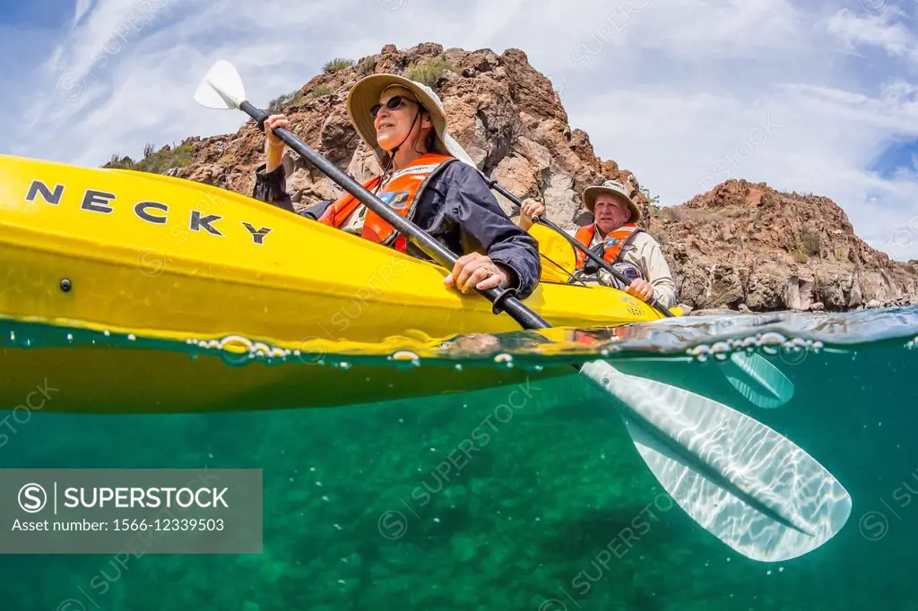 Lindblad Expeditions guests sea kayaking in Honeymoon Bay, Isla Danzante, Baja California Sur, Mexico.