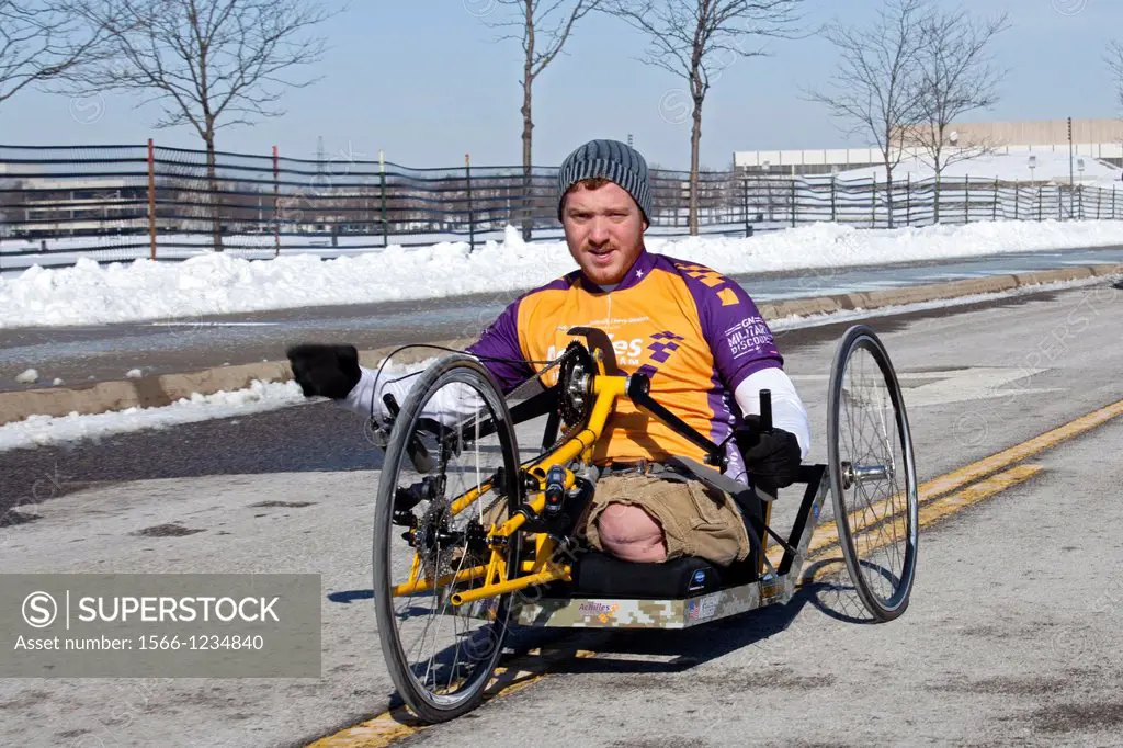 Sterling Heights, Michigan - Ben Maenza, who lost both legs while serving in the Marine Corps in Afghanistan, tests a handcycle prototype at the Gener...