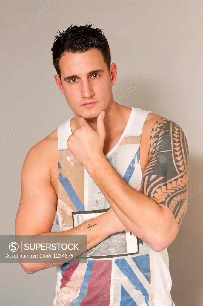 Handsome hunky young man in singlet