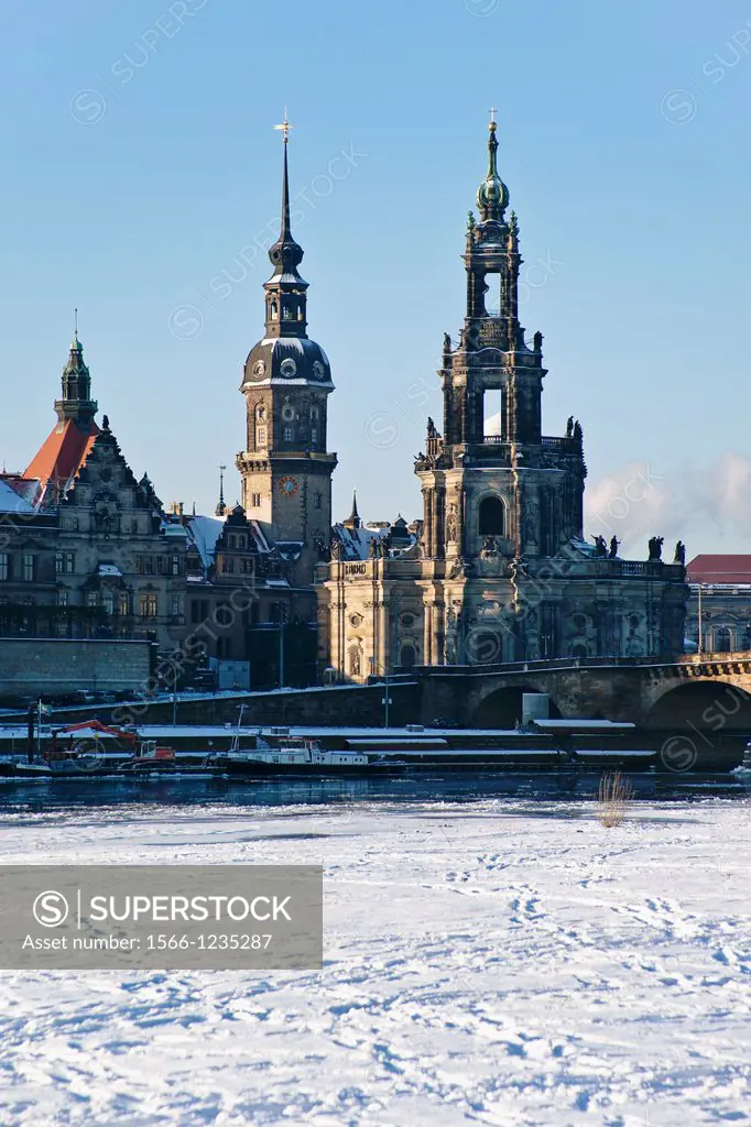 View over the Elbe river to the Catholic Court Church, to Hausmannsturm tower and the Georgentor Gate at wintertime, Dresden, Saxony, Germany, Europe