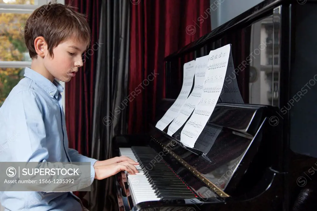 Boy plays the piano
