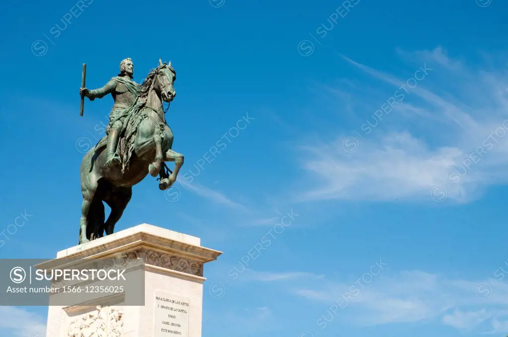 Felipe IV monument against blue sky. Oriente Square, Madrid, Spain.