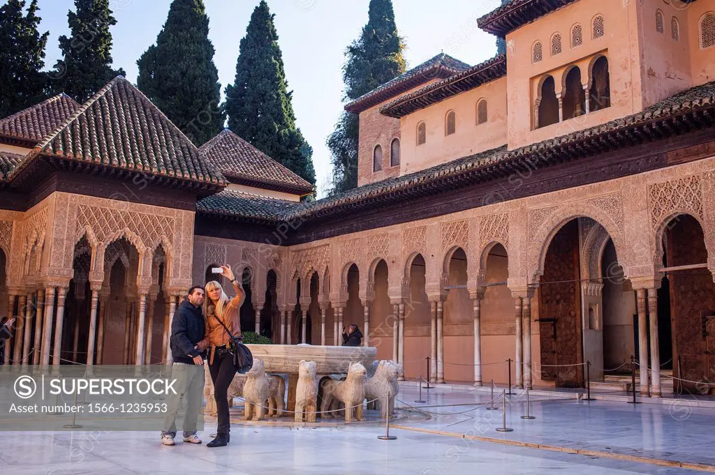 Tourists in Courtyard of the lions  Palace of the Lions  Nazaries palaces Alhambra, Granada  Andalusia, Spain