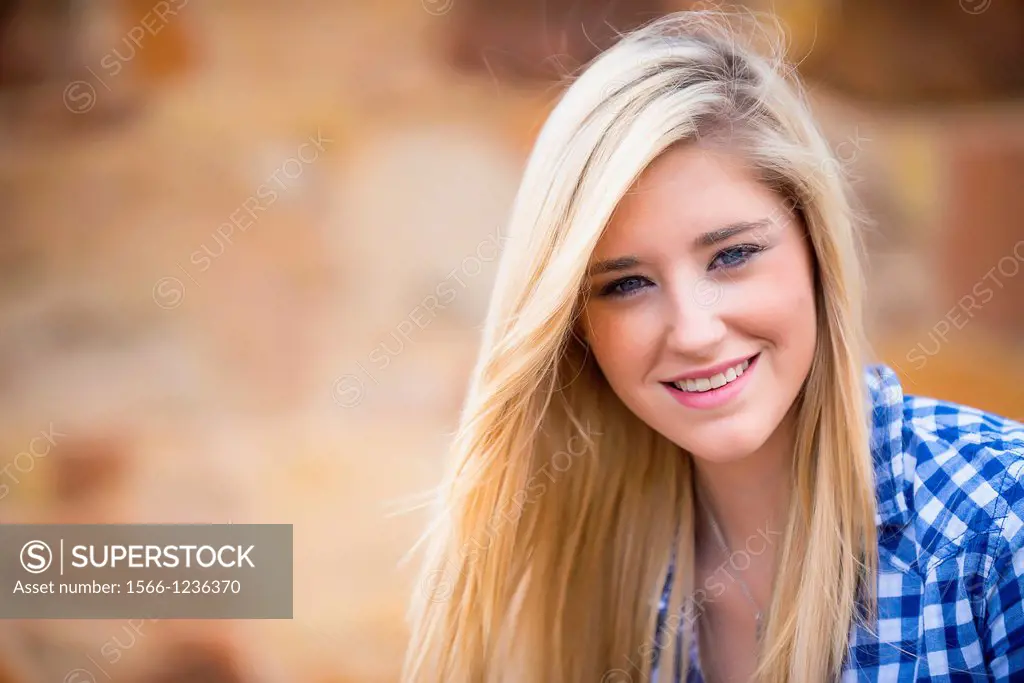 Portrait of female Caucasian teenager with long blond hair.